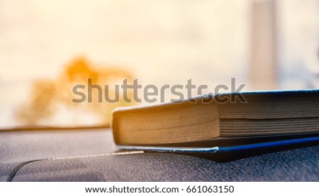 close up One old books on sunset background 