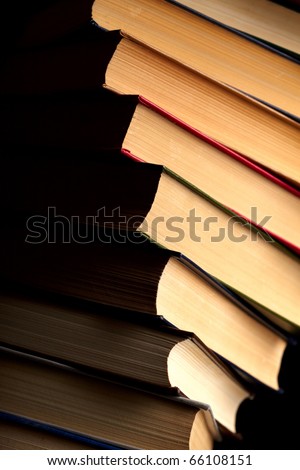 Pile of books on a black background