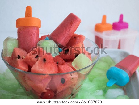Refreshing melons ice cream and melon pieces
