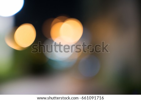Abstract blurred bokeh with green and yellow color background.