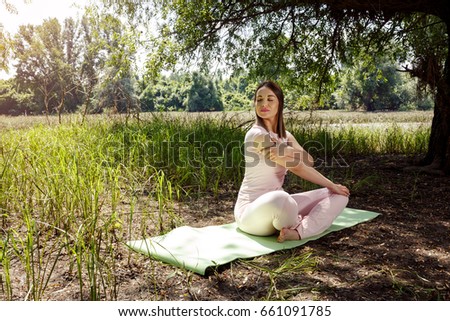 yoga and relax - young woman stretching and relaxing
