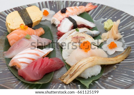 Sushi Set on black plate Royalty-Free Stock Photo #661125199