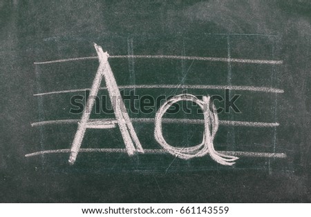 Capital and lowercase letter A on chalkboard, blackboard texture