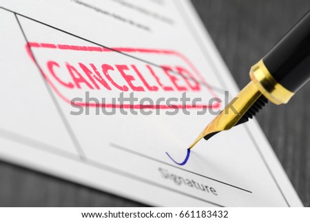 Red seal cancelled stamped on a form and fountain pen. Macro shot. Soft focus. Royalty-Free Stock Photo #661183432