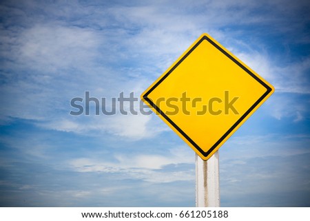 Blank on traffic sign on yellow background with cloudy blue sky. symbol for transportation regulations. image for background, wallpaper and backdrop.