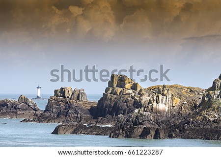 Beautiful lighthouse in the sea, coastline in Brittany, France