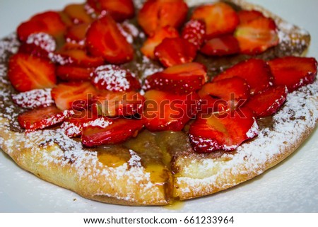 Sweet pizza with strawberries and chocolate