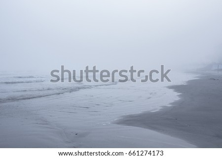 Galveston beach Texas covered in fog