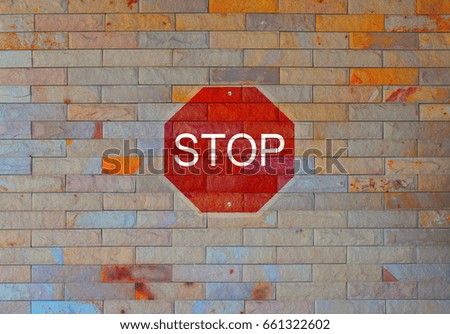 Stop sign on the Brick Wall