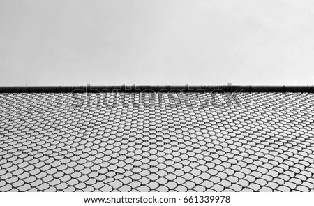 cage metal wire at the prison - monochrome