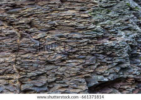 Close up photo of grey cliff texture