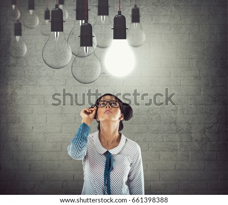 Businesswoman with glowing light bulb
