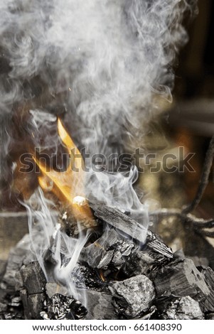 Carbon, flame, detail of smoke and fire
