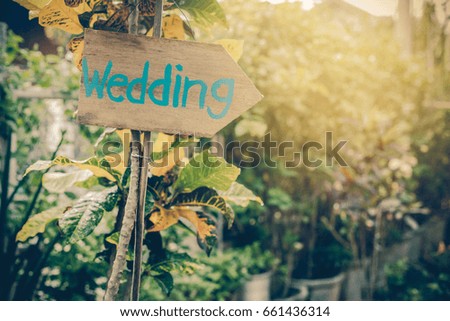 Wooden signboard with the inscription in  paint wedding. Wood hand made wedding decoration table.Vintage tone