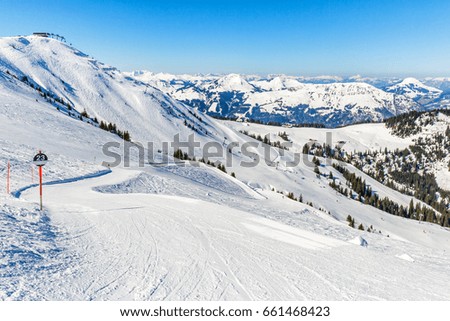Snowy winter landscape of a ski resort in the Alps