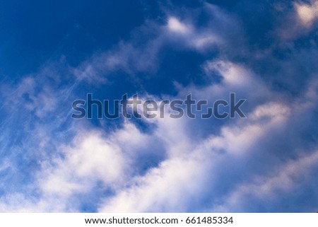 white fluffy cloud in the blue sky