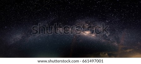 Blurred panorama sky milky way and star on dark background.with grain and select white balance.