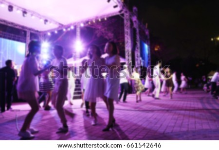 Blurred picture of outdoor concert and dance festival with beautiful light