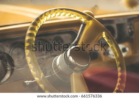 classic car with mirror and steering wheel , vintage picture style