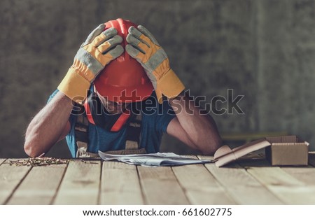 Disappointed Sad Caucasian Contractor Worker Facing Legal Problems. Bond, Insurance, Work Injury Concept Photo.
