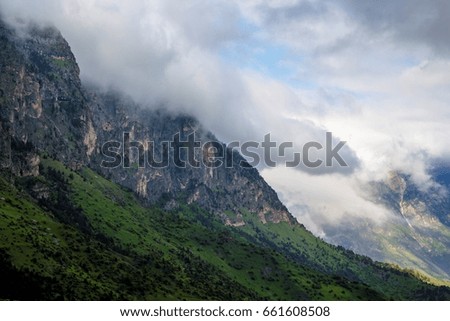 Mountain landscape, beautiful view of the picturesque gorge in clouds, cloudy weather, the nature of the North Caucasus