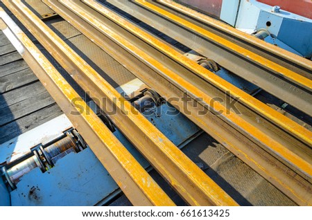 Railhead elements. Transportation of long new rails on a freight car. Endless path. The rail lash. Special load.