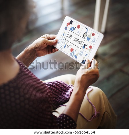 Woman working on digital device network graphic overlay