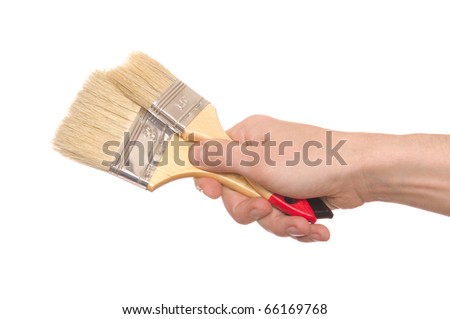 hand with a brush isolated on white background