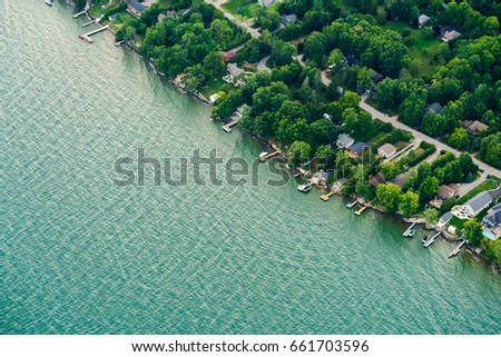 Houses in residential suburbs by the lake, Toronto, Ontario, Canada. aerial picture from ontario canada 2016 Royalty-Free Stock Photo #661703596