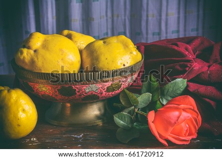 Old oriental vase, quince and rose
