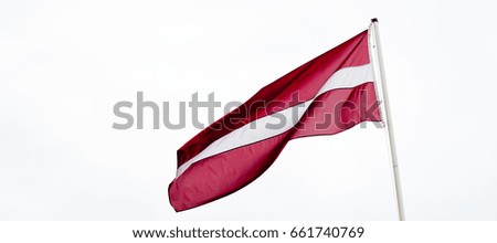 Latvian flag on bright background