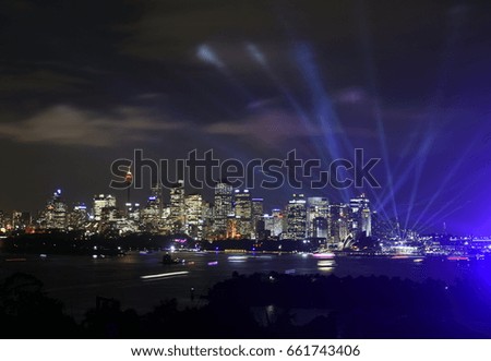 Sydney cityscape at night during Vivid Sydney light festival. Free annual outdoor event of light music and ideas.