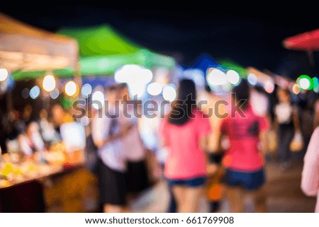 Blurry image of night market on street background with bokeh