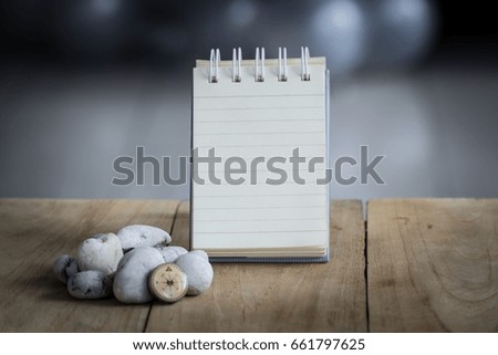 Paper for notes placed on wooden boards  with blurred background