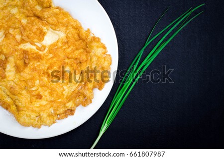 Omelet on White dish close up