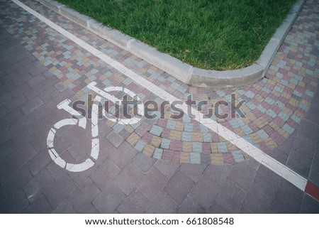 bike path is embedded paving stone tiles in the Park