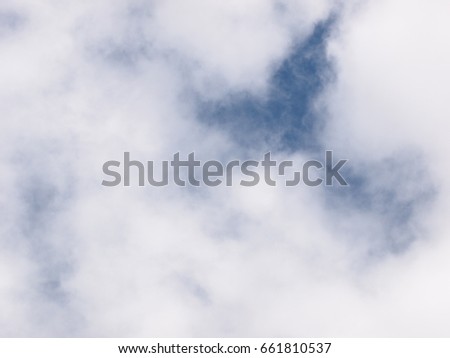 high white clouds in winter with clear light blue sky on a sunny day for use as backdrop background picture