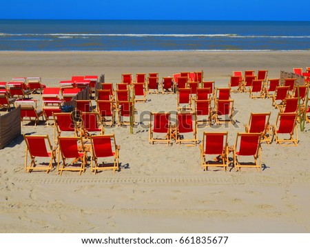 RED DECKCHAIR ON THE BEACH OF THE TOUQUET , PAS DE CALAIS , HAUTS DE FRANCE , FRANCE 
