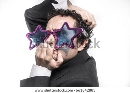 Businessman with pop star glasses screaming nervous and anxious for money
