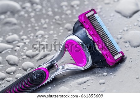wet disposable razor woman isolated.closeup Royalty-Free Stock Photo #661855609