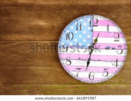 Old Clock america flag hanging on  wood wall ,with copy space,vintage clock concept.