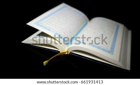 Blurry Quran with Amazing light from candles