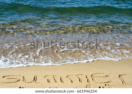 Summer letters written on the beautiful sea beach.