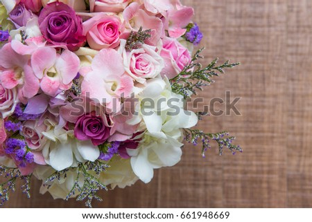 Beautiful fresh wedding bunch of pink lilac purple white and violet chrysanthemum rose and peony flowers in hand copyspace, horizontal picture