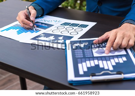 business statistics success concept : businessman analytics financial accounting market chart and graph line  ,selective focus. 