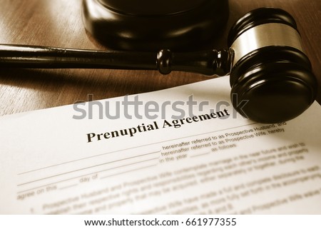 Prenuptial contract and court gavel                                Royalty-Free Stock Photo #661977355