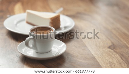 espresso and cheesecake on table, wide photo