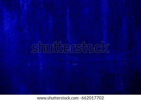Dark blue background created from picture of dirty old vintage wooden door surface.

