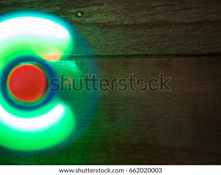 Moving hand spinner with light
