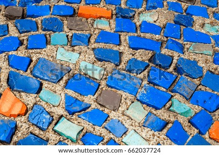 Texture, background, pattern. Closeup photo of multi-colored mosaic stones. Structure design decor. Swimming pool wall and floor finishing